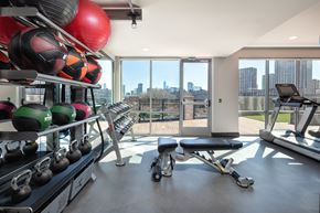 Jersey City apartment for rent - A gym with a view of the city.