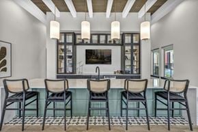 Austin apartment for rent - A modern dining room with a glass table and chairs.