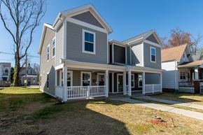 Evansville apartment for rent - Thoughtfully designed two-story residence featuring a covered front porch, clean lines, and a spacious exterior setting.