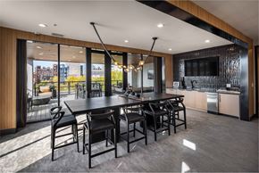Cleveland apartment for rent - A modern dining room with a large table and chairs.