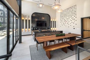 Cleveland apartment for rent - A modern kitchen with a wooden table and chairs.