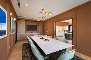 Jersey City apartment for rent - A dining room with a long table and chairs.