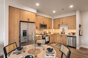 Jersey City apartment for rent - A modern kitchen with a dining table set for two.