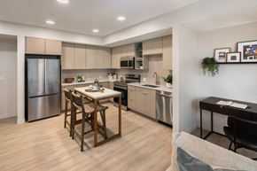 Cleveland apartment for rent - A modern kitchen with a dining table and chairs.