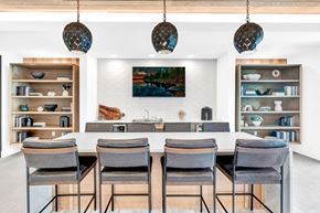 Austin apartment for rent - a dining room with a table and chairs and a mirror
