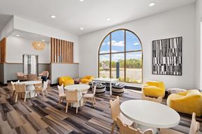 San Antonio apartment for rent - a room with tables and chairs and a large window