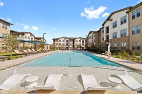 San Antonio apartment for rent - a swimming pool with apartments in the background