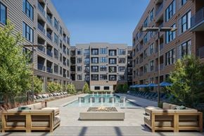 Charlotte apartment for rent - A large courtyard with a pool surrounded by buildings.