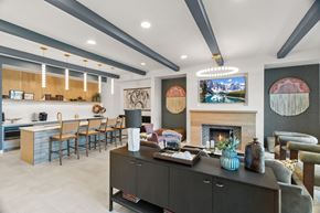 Fort Worth apartment for rent - A modern living room with a fireplace and a TV mounted on the wall.