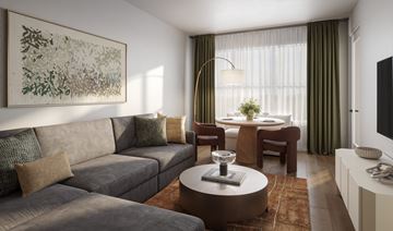 Harrison apartment for rent - A living room with a grey couch, a coffee table, and a painting on the wall.