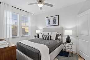 San Antonio apartment for rent - a bedroom with a bed and a ceiling fan