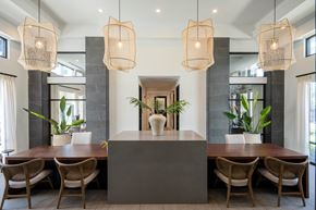 Sanford apartment for rent - a dining area with a large table and chairs and a large island with three lamps