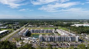 Sanford apartment for rent - A large apartment complex with a swimming pool in the middle.