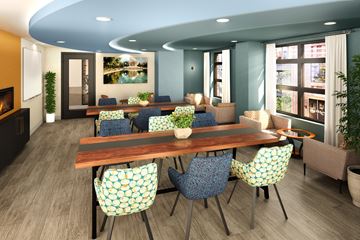 Washington apartment for rent - A dining room with a wooden table and chairs with a blue and yellow pattern.