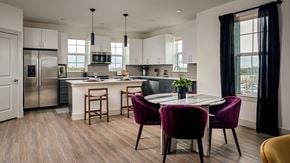 Austin townhouse for rent - A modern kitchen with a dining table and chairs.