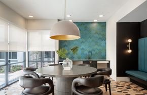 Kissimmee apartment for rent - A modern dining room with a round table and grey chairs.