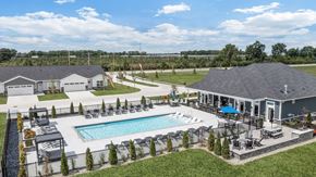 Perrysburg apartment for rent - Resort-style community pool featuring in-water lounge seating, expansive sundecks, and beautifully designed outdoor gathering spaces.