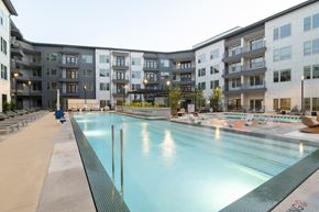 Carrollton apartment for rent - A large indoor swimming pool in a residential building.