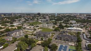 San Antonio apartment for rent - Aerial view of a modern apartment community featuring landscaped grounds, residential buildings, and thoughtfully designed outdoor spaces.