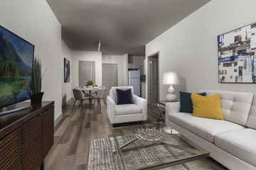 Irvington apartment for rent - A living room with a white couch and a coffee table.