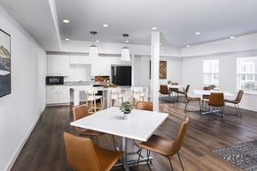 Columbus apartment for rent - a dining room and kitchen with a white table and chairs