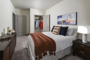 Irvington apartment for rent - A bedroom with a bed, a nightstand, and a wardrobe.