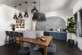 San Antonio apartment for rent - A modern dining room with a wooden table and chairs.
