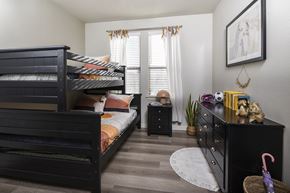San Antonio apartment for rent - A bedroom with a bunk bed and a dresser.