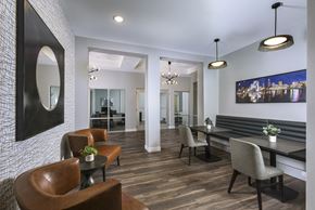 Cleveland townhouse for rent - Modern resident lounge featuring private booth seating, contemporary lighting, and inviting spaces for work, study, or socializing.
