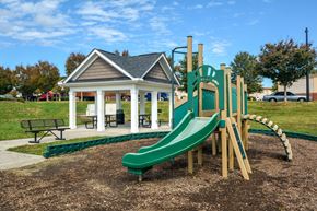 Raleigh apartment for rent - a playground with a slide and a gazebo in a park