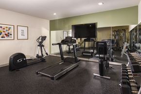 Irvington apartment for rent - a gym with cardio equipment and a flat screen tv