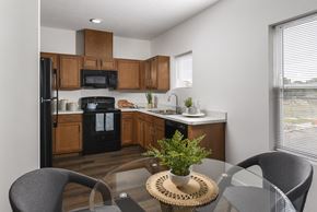 Cleveland townhouse for rent - Inviting eat-in kitchen showcasing contemporary cabinetry, ample counter space, and a comfortable dining area for everyday meals.