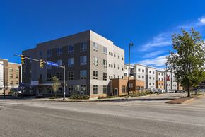 Cleveland apartment for rent - Modern apartment community featuring contemporary architecture, landscaped streetscapes, and a prominent corner location near neighborhood amenities.
