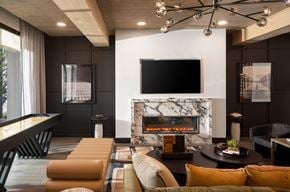 North Richland Hills apartment for rent - a living room with a fireplace and a tv above it