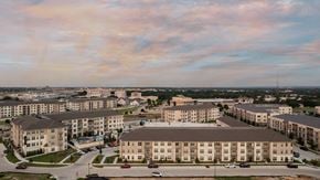 North Richland Hills apartment for rent - an aerial view of an urban campus with buildings and cars