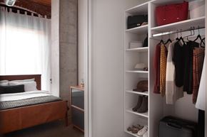 Wakefield apartment for rent - A bedroom with a bed, a wardrobe and a window.