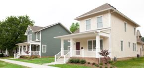 Evansville apartment for rent - A house with a green and beige exterior.