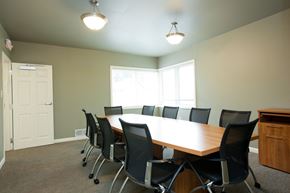 Evansville apartment for rent - A conference room with a long table and chairs.