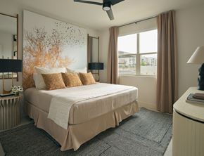 Las Vegas apartment for rent - A bedroom with a large bed and a ceiling fan.