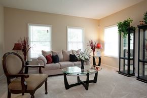 Evansville apartment for rent - A living room with a couch, chair, and table.