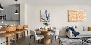 Venice apartment for rent - A modern dining room with a wooden table and chairs.