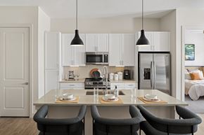 Venice apartment for rent - A modern kitchen with a dining table set for two.