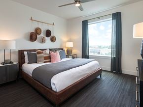 Austin apartment for rent - a bedroom with a large bed and a window