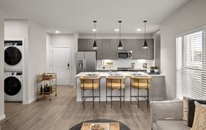Killeen apartment for rent - an open kitchen and living room with an island and a washer and dryer