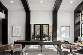 Austin apartment for rent - a clubroom with a table and chairs and a large window