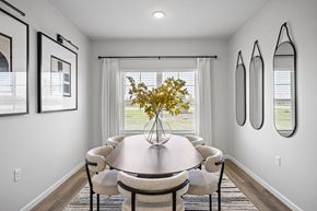 Perrysburg apartment for rent - Elegant dining area featuring contemporary furnishings, designer lighting, and a bright, inviting atmosphere.