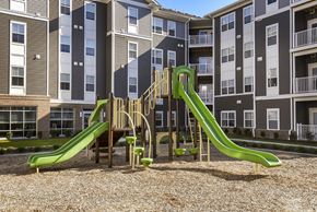 Columbus apartment for rent - a playground at an apartment complex with slides