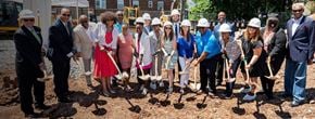 Norwalk apartment for rent - a group of people with shovels standing in front of a construction site