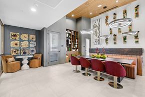 Las Vegas apartment for rent - A modern room with a long table and chairs.