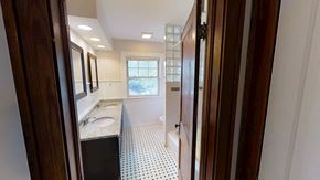 Ann Arbor apartment for rent - A bathroom with a sink, mirror, and tiled floor.